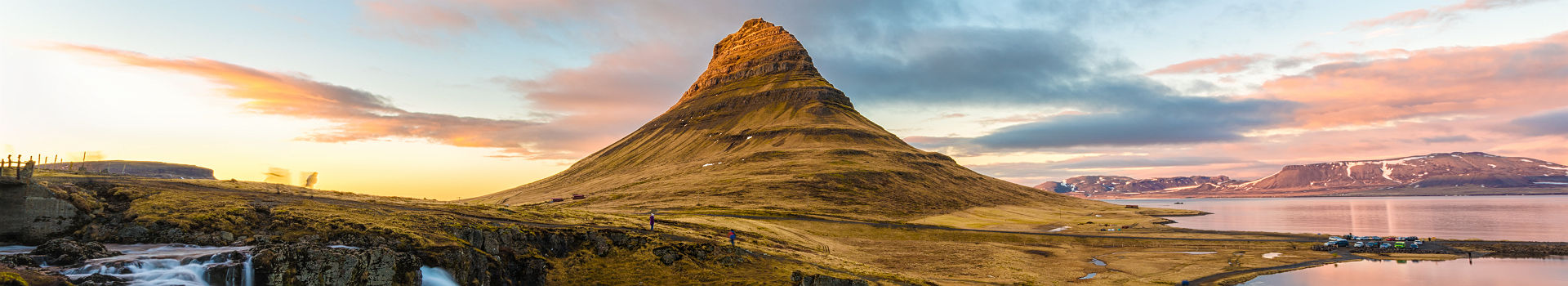 Evening long exposure shot at Kirkjufell, Grundarfjordur town, West Iceland with the moving cloud over the mountain