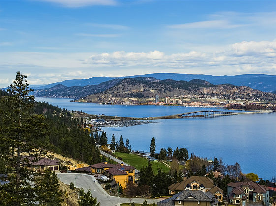 A view of the bridge over Okanagan Lake between West Kelowna and Kelowna Brititsh Columbia Canada with a view of the Kelowna skyline