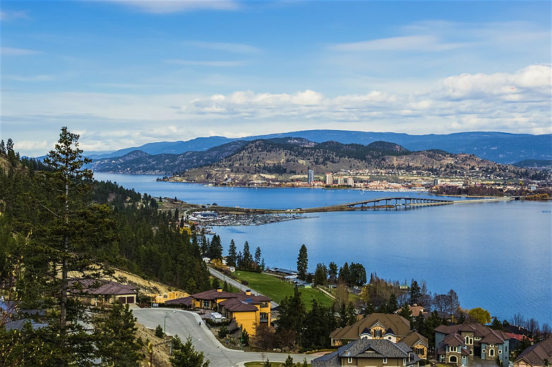 A view of the bridge over Okanagan Lake between West Kelowna and Kelowna Brititsh Columbia Canada with a view of the Kelowna skyline