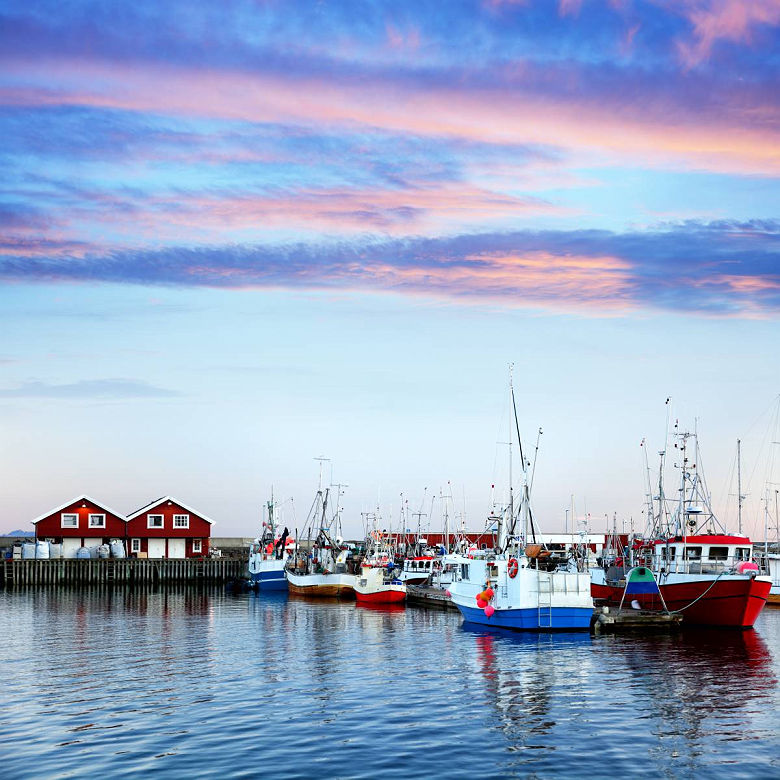 Red rorbu buildings in Bodo harbor, Norway