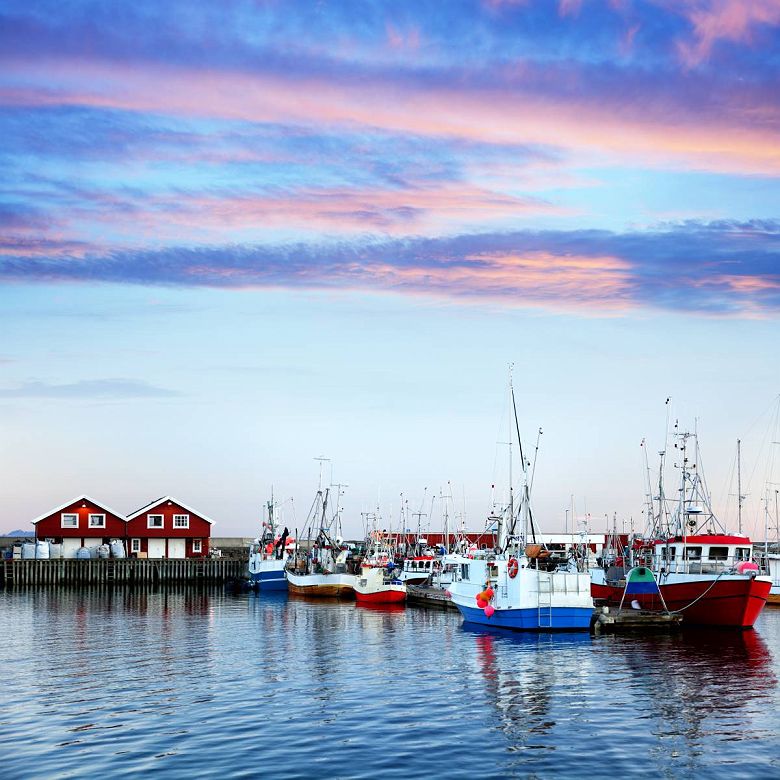 Red rorbu buildings in Bodo harbor, Norway
