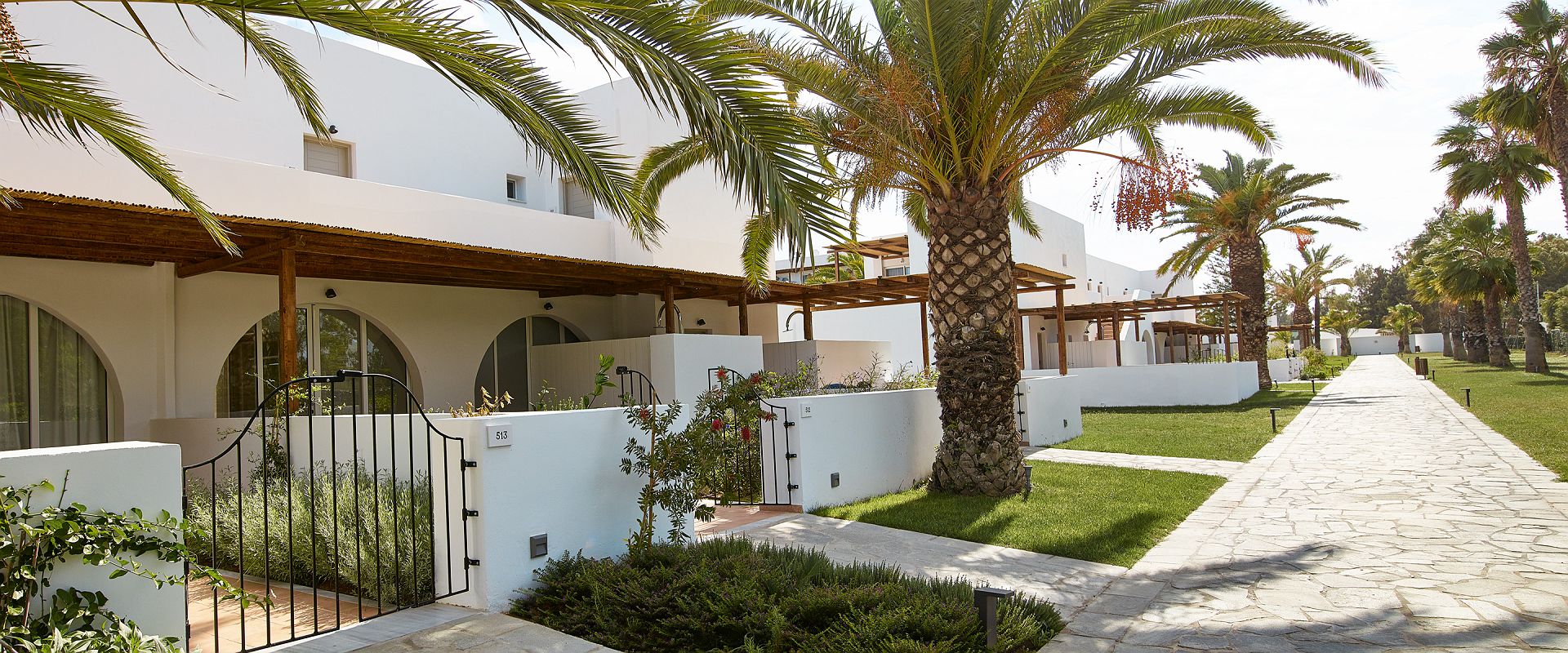 casa marron grecotel   oliva bungalow shaded patio   grece